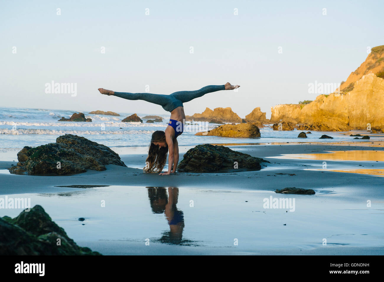 Dancer Handstand Young female dancer poised in handstand on beach, Los Angeles ...