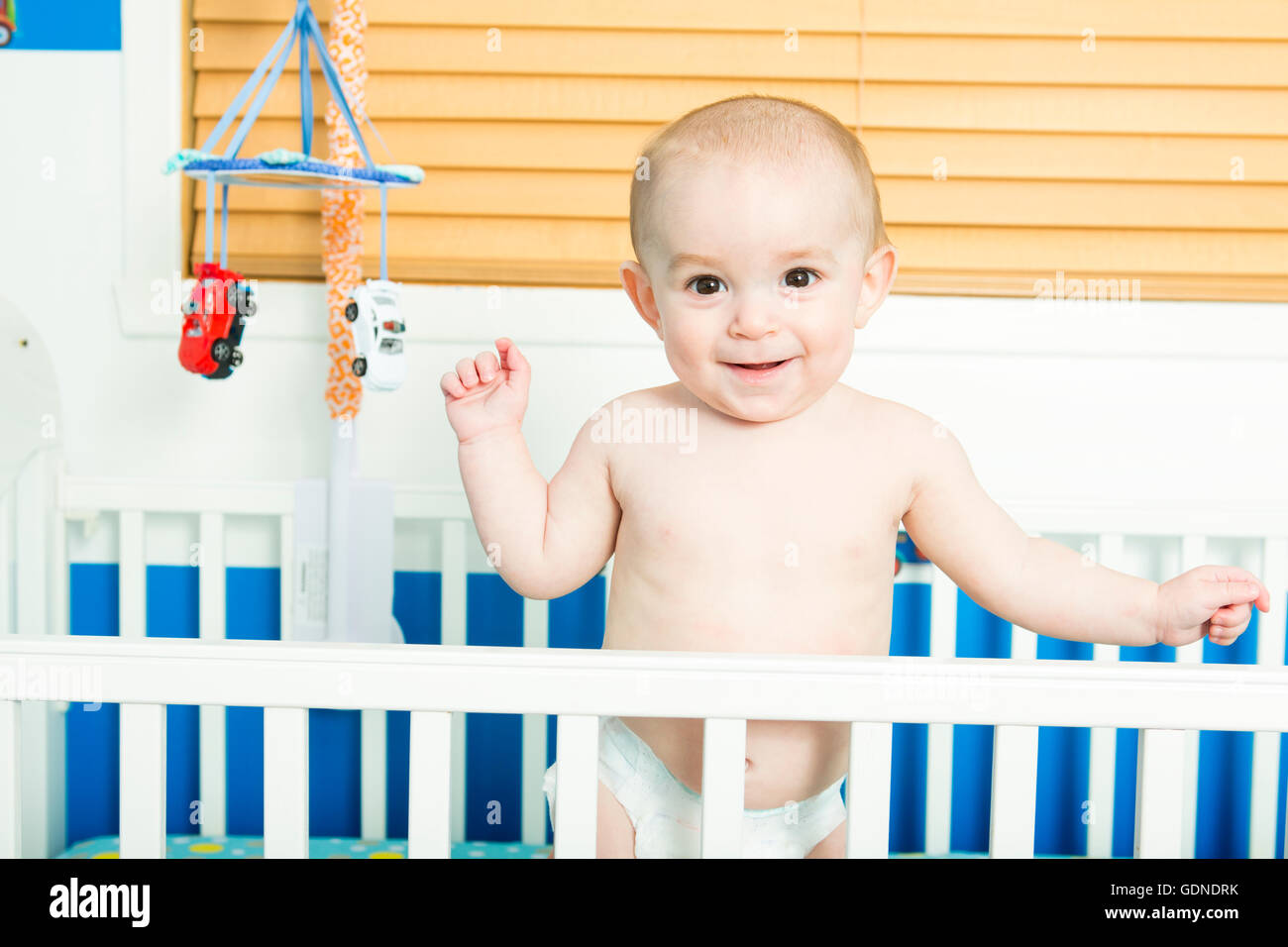 baby in white crib Nursery interior and bedding for kid Stock Photo - Alamy