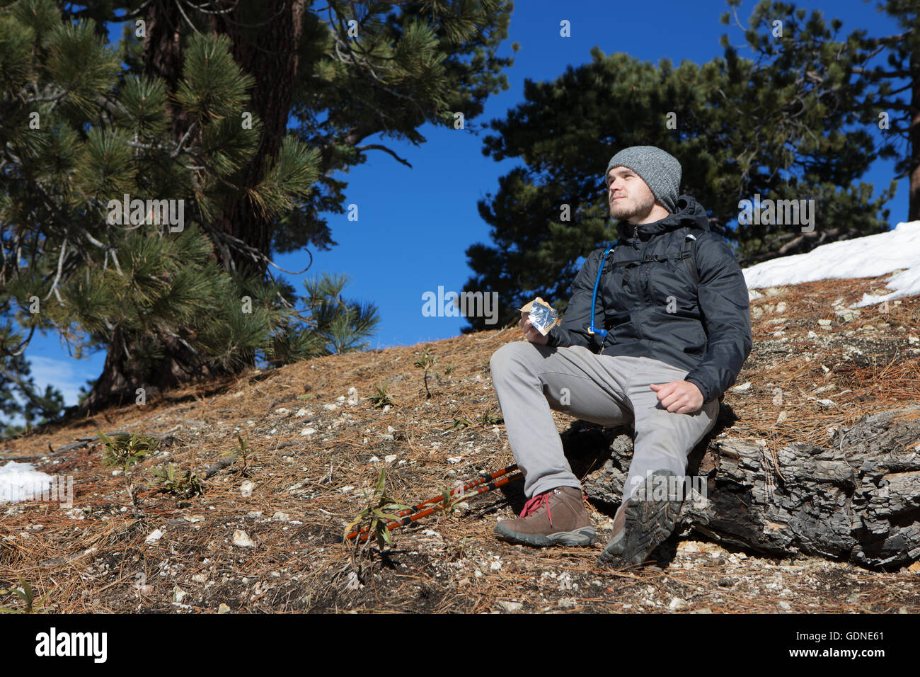 Hiker taking break, Mount Baldy, California Stock Photo