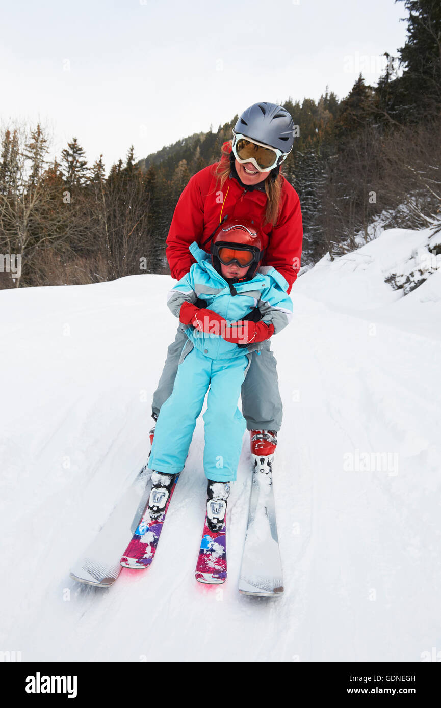 Portrait of mother and son on skis Stock Photo