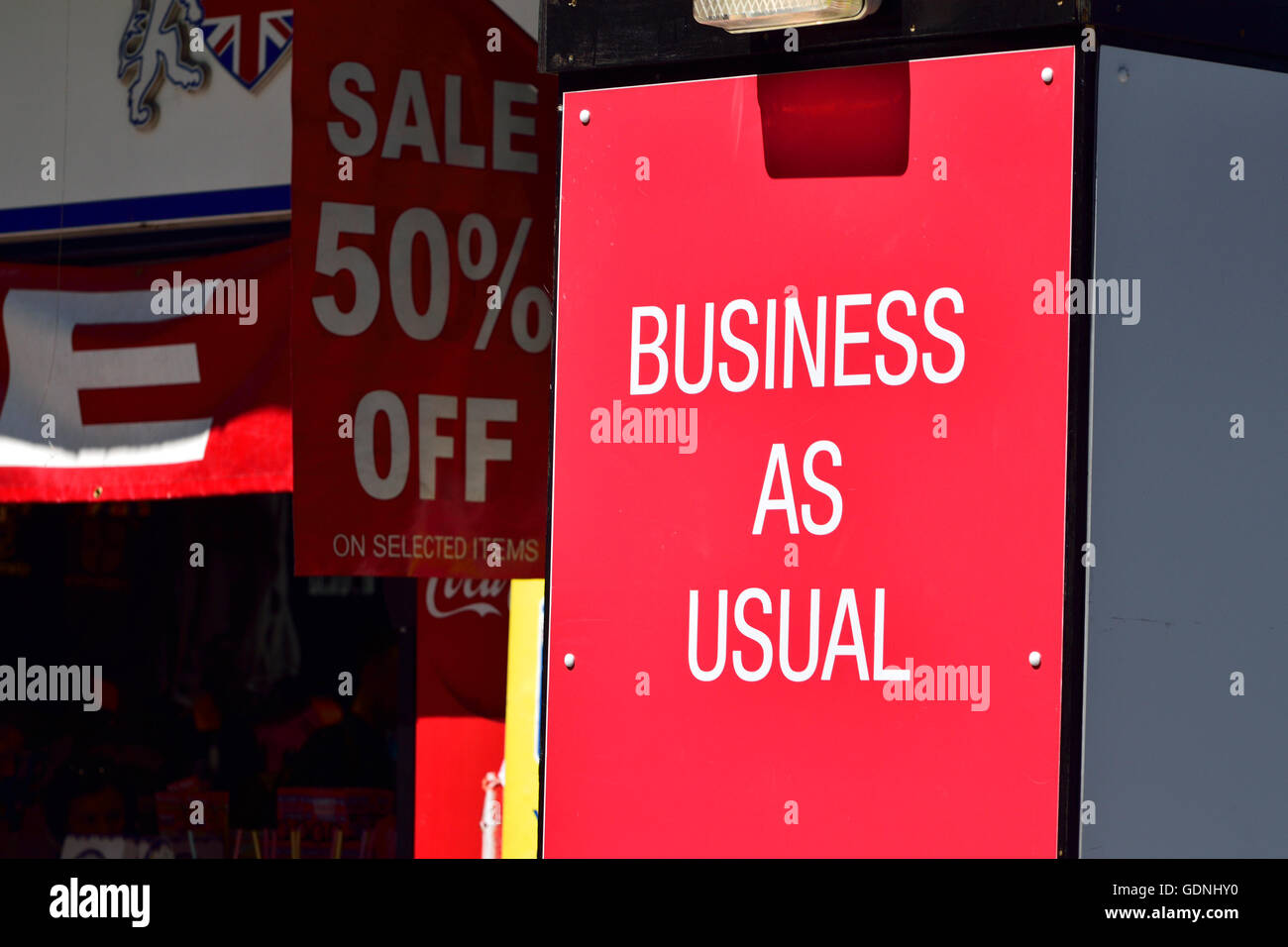 London, England, UK. Business as Usual sign outside a shop Stock Photo
