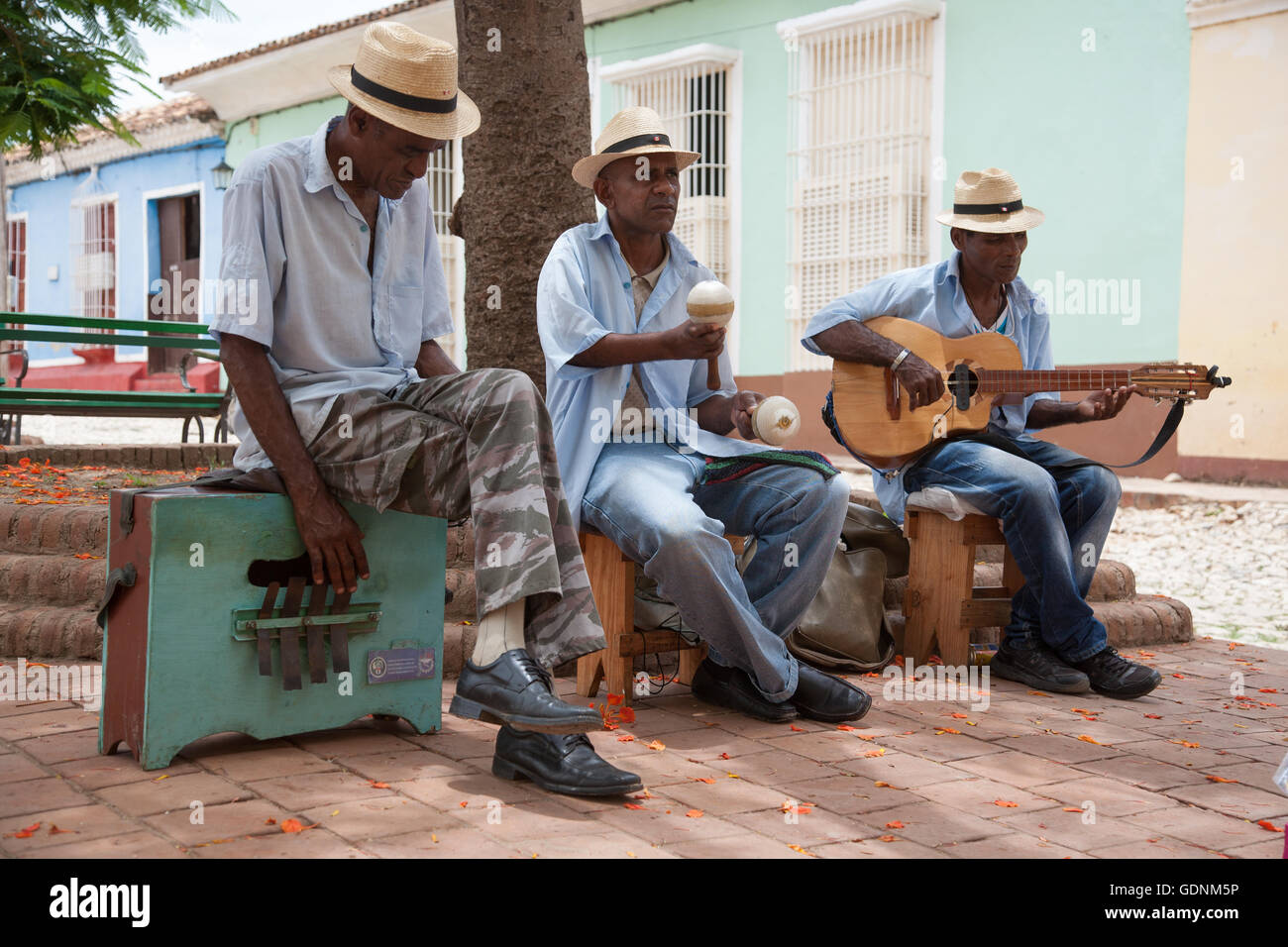 A male trio of buskers from the music group Sorpresa Trinitaria, playing in Plazuela del Cristo, Trinidad, Cuba Stock Photo