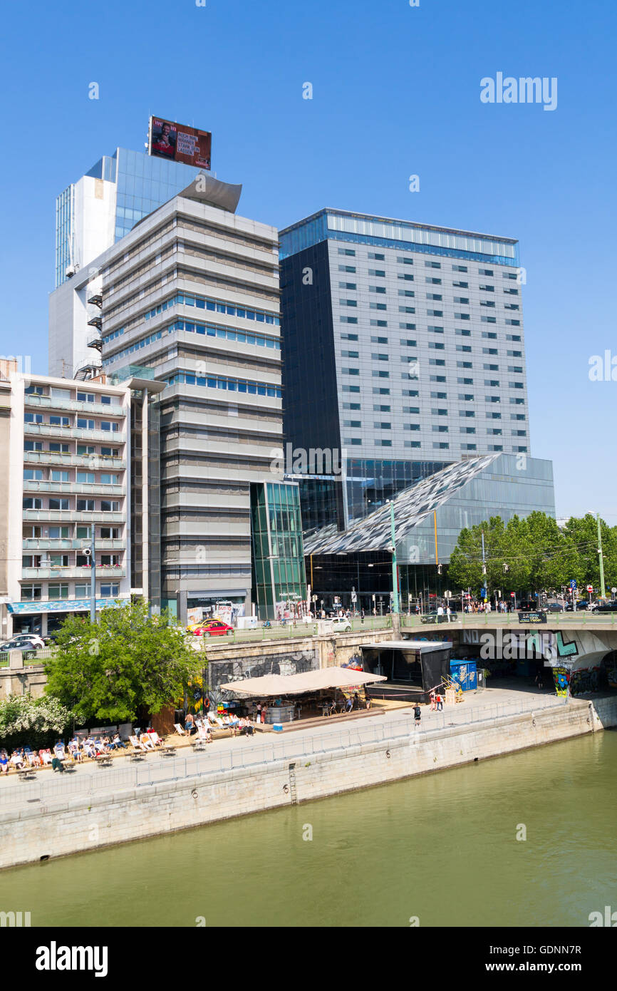 Media Tower, Design Tower and waterfront cafes on quay of Little Danube canal in city of Vienna, Austria Stock Photo