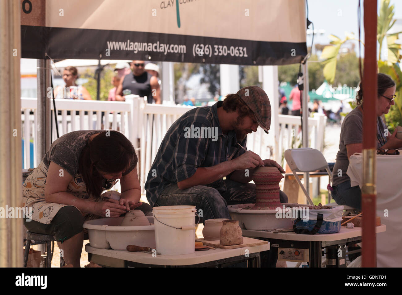 Costa Mesa, California July 16, 2016 Potters shape clay on a wheel