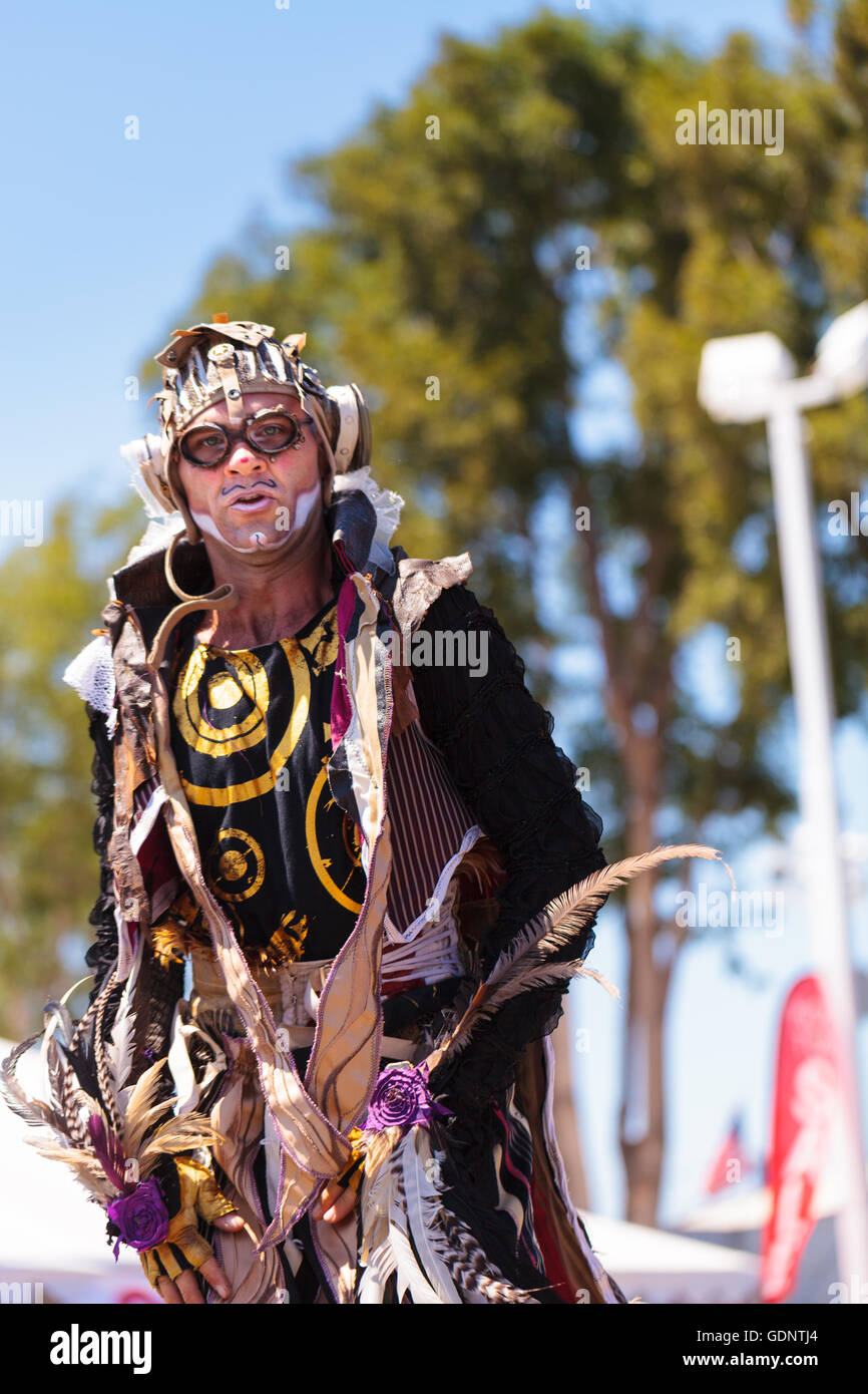 Theatrical circus performer Derrick Gilday, part Mango and Dango, performs with Dragon Knights steampunk stilt walkers Stock Photo