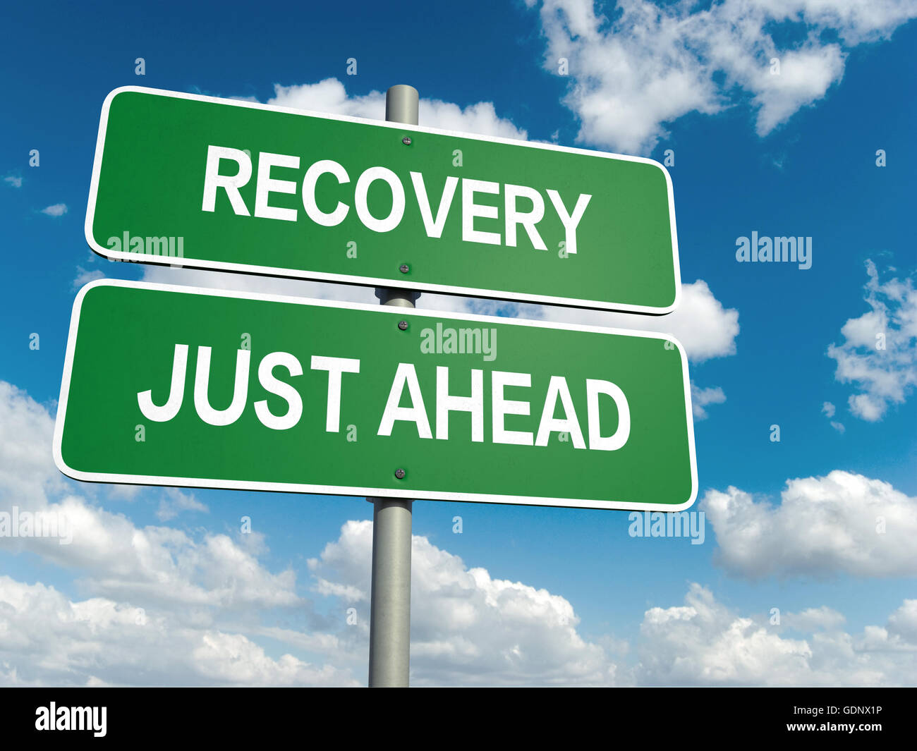 A road sign with road to recovery words on sky background Stock Photo