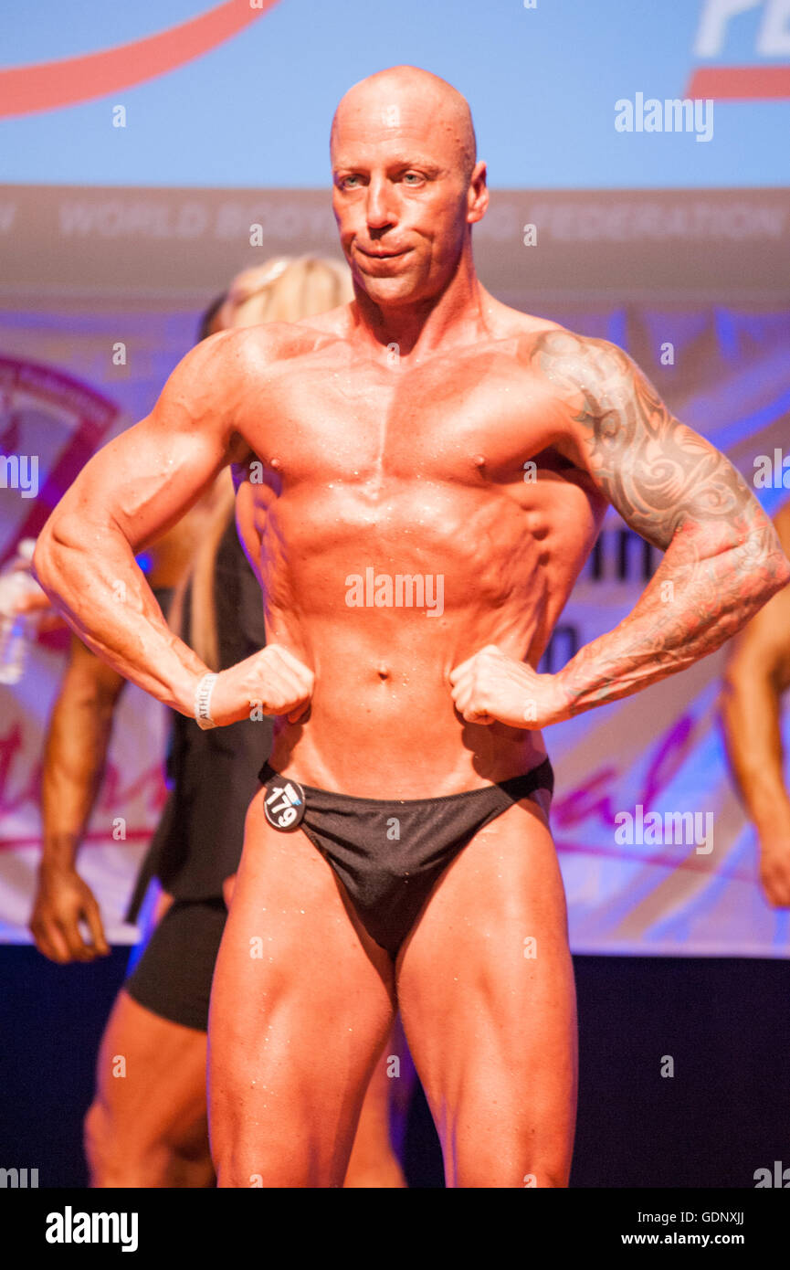 Male bodybuilder Erik Stobbe shows his best lats spread front pose Stock Photo