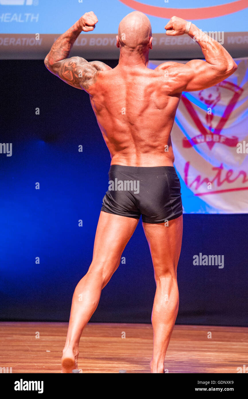 Male bodybuilder Erik Stobbe shows his best back double biceps pose Stock Photo