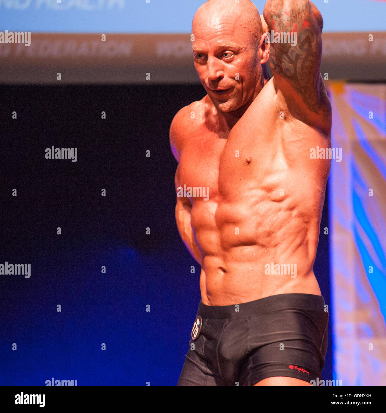 Male bodybuilder Erik Stobbe shows his best abdominal pose Stock Photo