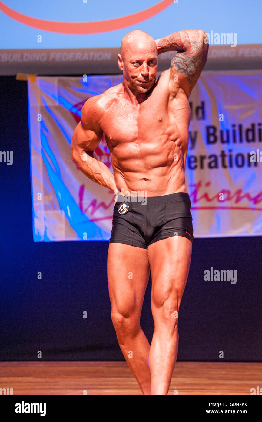 Male bodybuilder Erik Stobbe shows his best abdominal and thighs pose