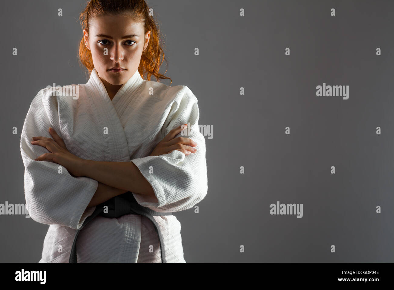 Confident Woman Wearing Karate Kimono with Crossed Arms Stock Photo Alamy