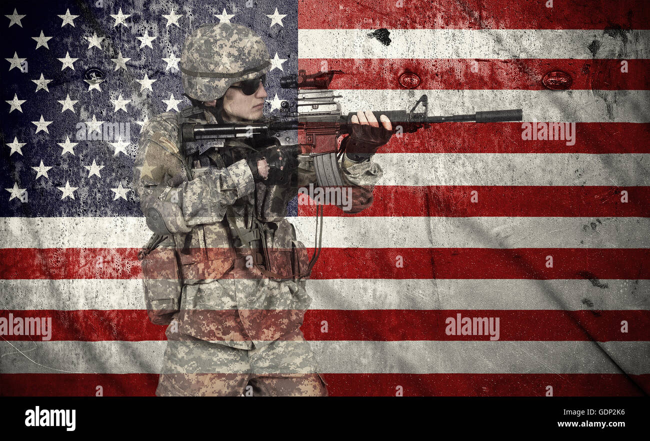 soldier holding rifle on a usa flag background, double exposure Stock Photo