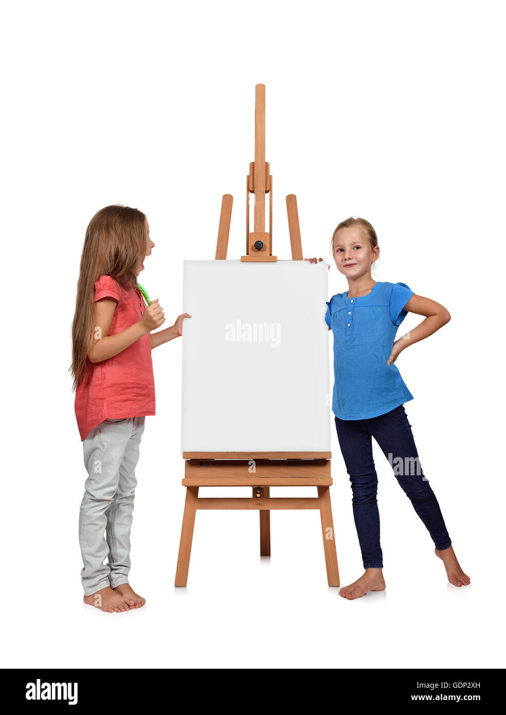 two little girl standing near a blank easel Stock Photo - Alamy