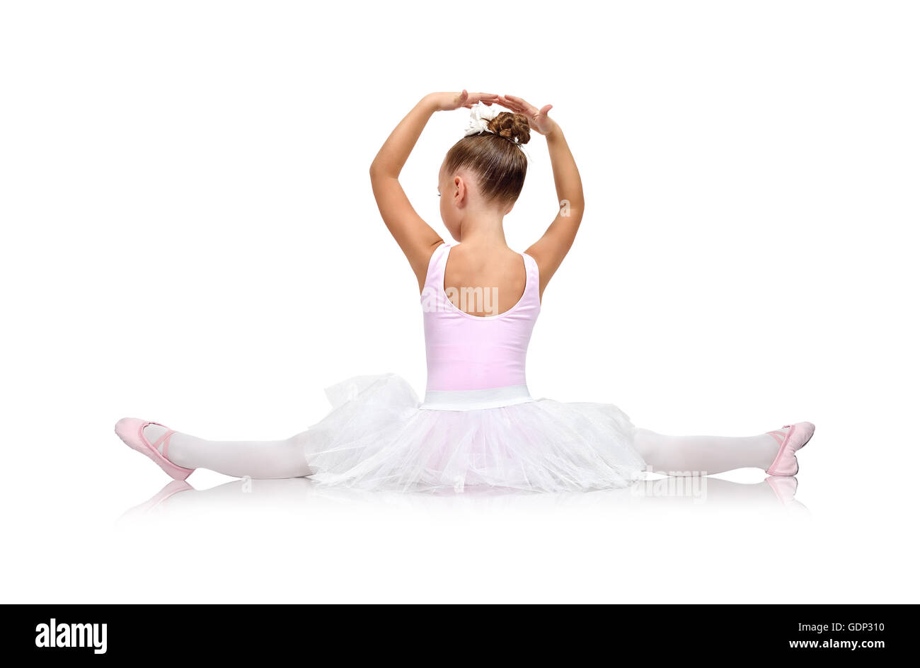 little ballerina in tutu sitting on floor, back view Stock Photo