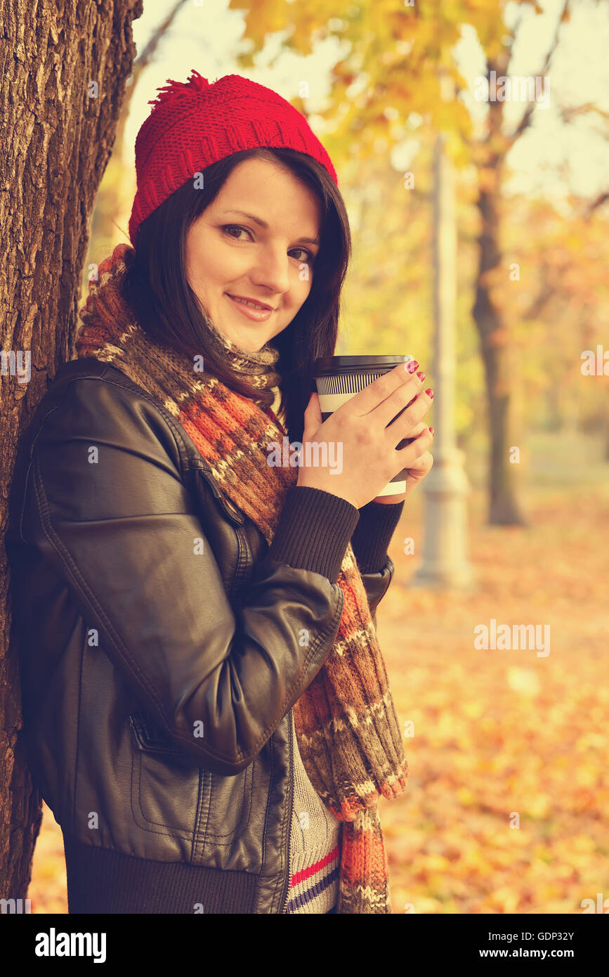 Girl drinking coffee in disposable cup. Vintage photo Stock Photo Alamy