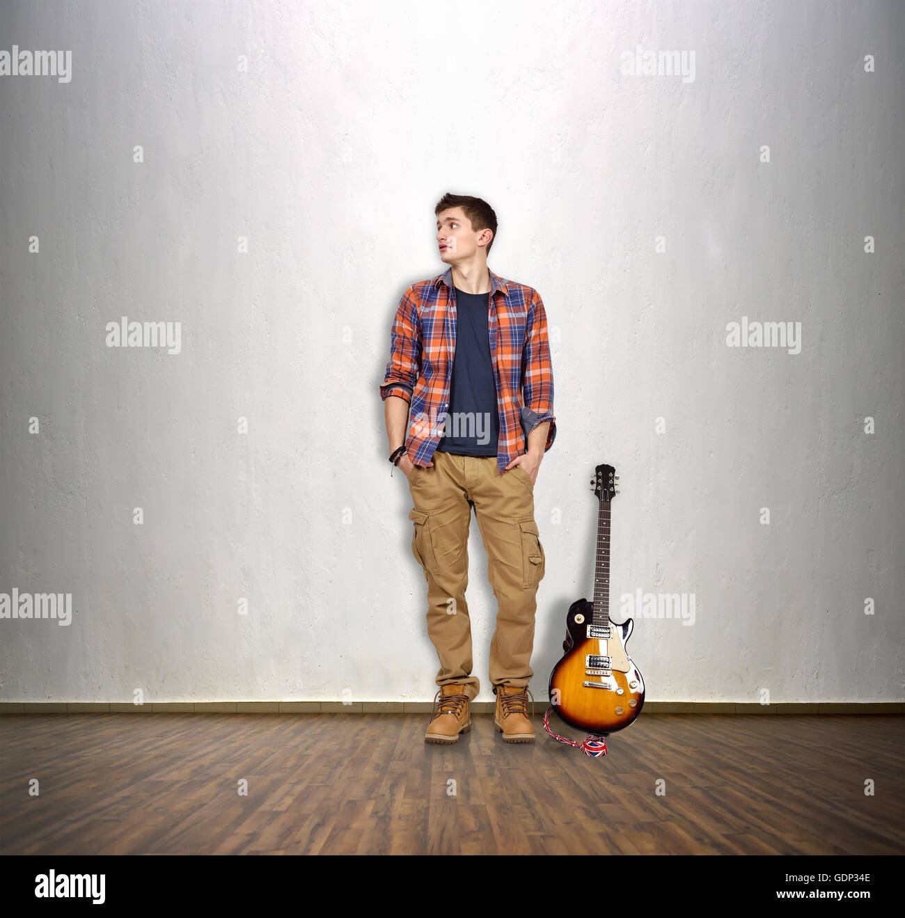 Alamy Rocker Rocker musician and electrical guitar in room Stock Photo - Alamy