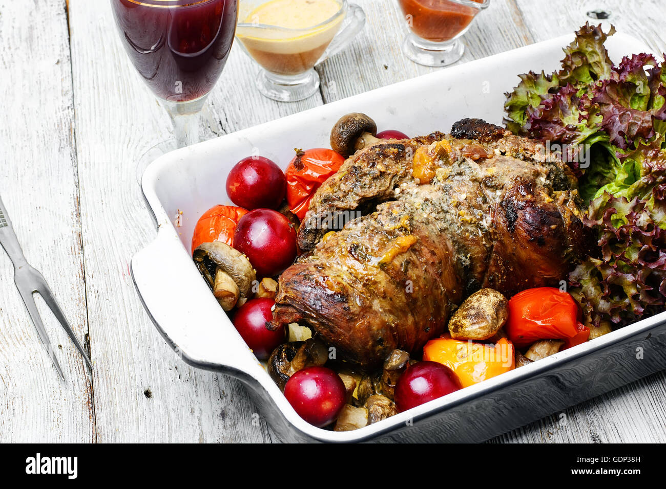 Form baked meat loaf of veal with plum sauce,seasoning and wine Stock