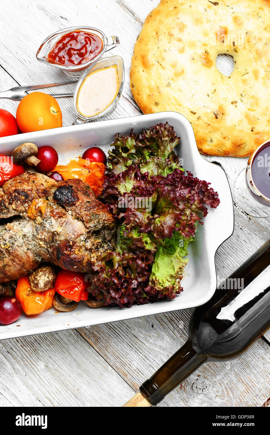 Form baked meat loaf of veal with plum sauce,seasoning and wine Stock