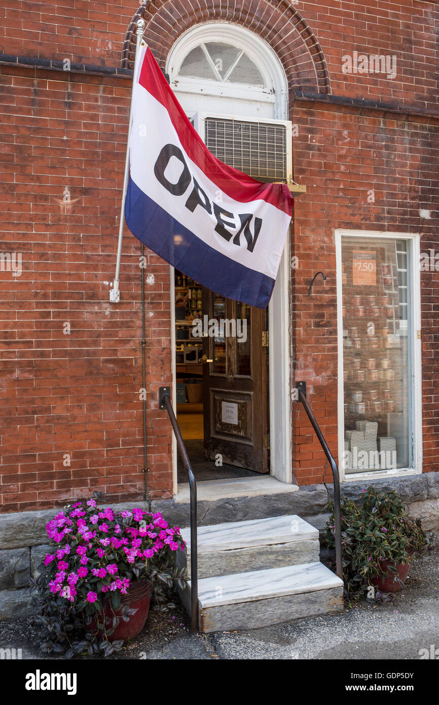 Berkshires - open flag flying in front of a Yankee Candle store in Stockbridge, MA store Stock Photo