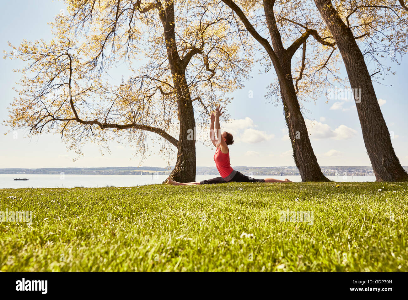 Side view of woman in splits yoga position Stock Photo