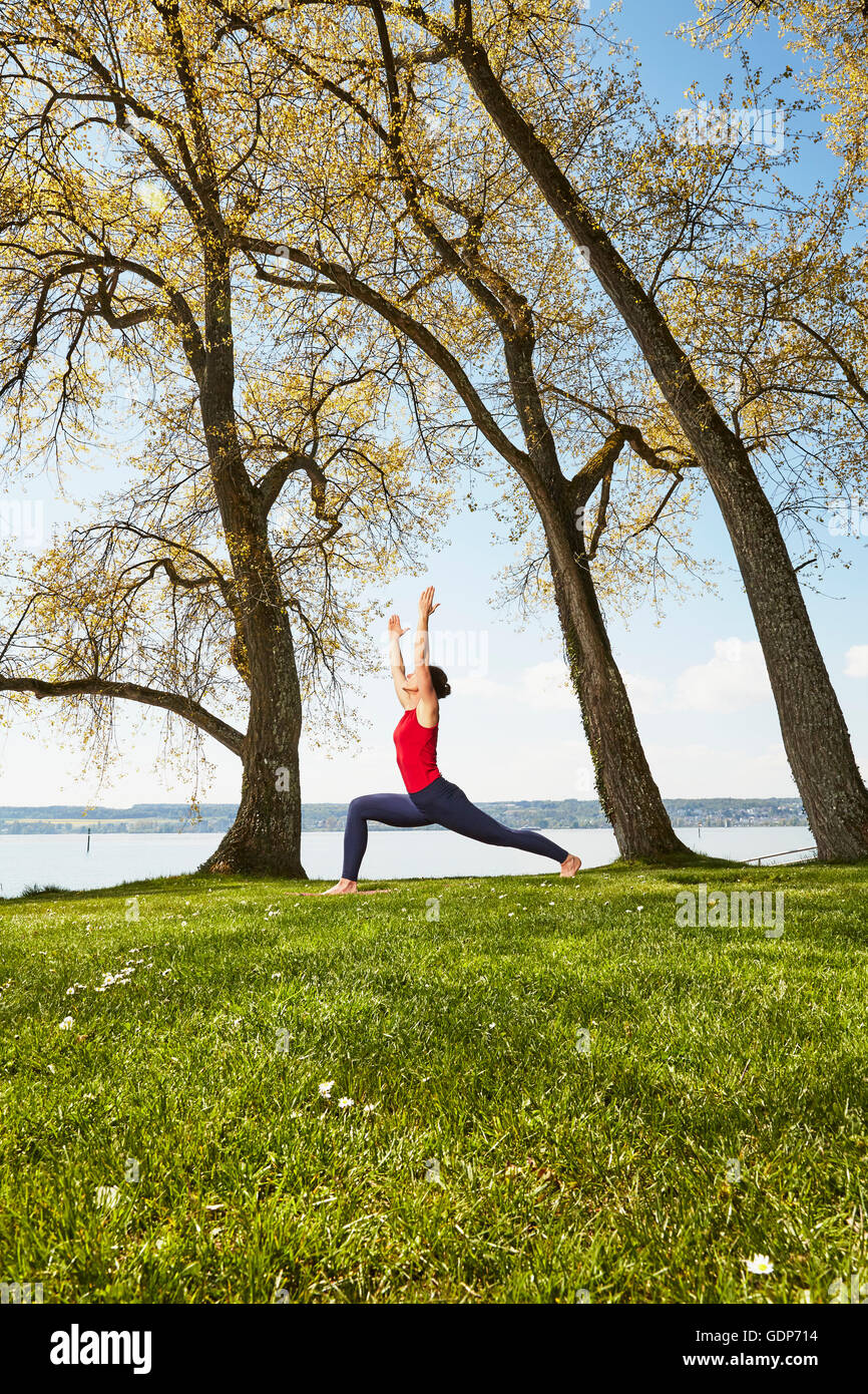 Side view of woman arms raised in yoga position Stock Photo