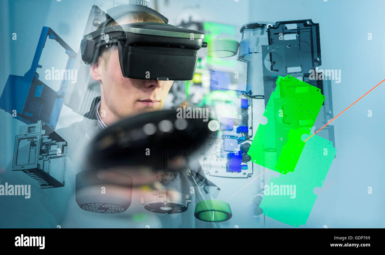 Composite image of engineer wearing VR headset in virtual reality suite Stock Photo