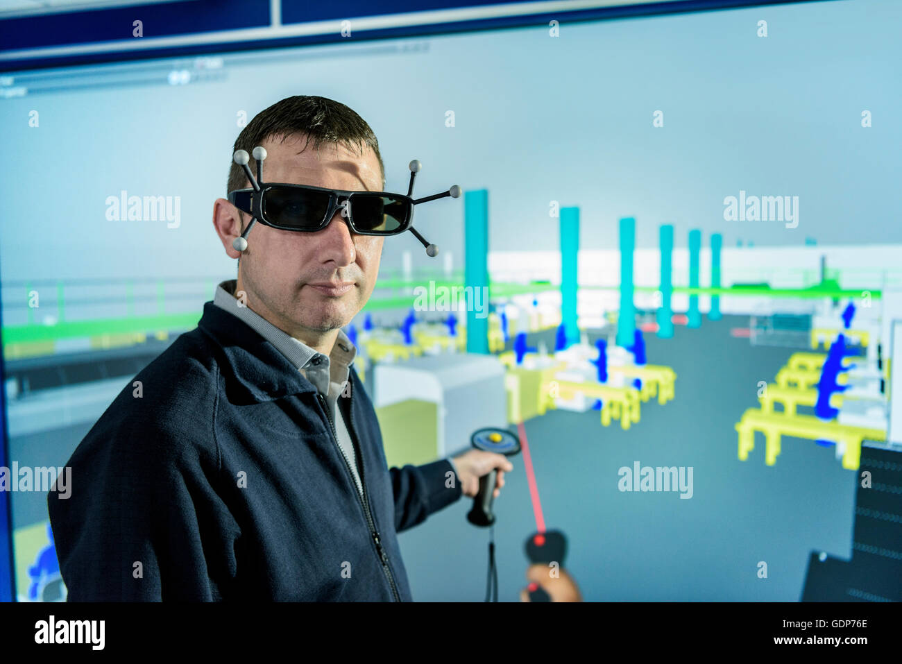 Portrait of engineer with factory graphic in 3D in virtual reality suite Stock Photo