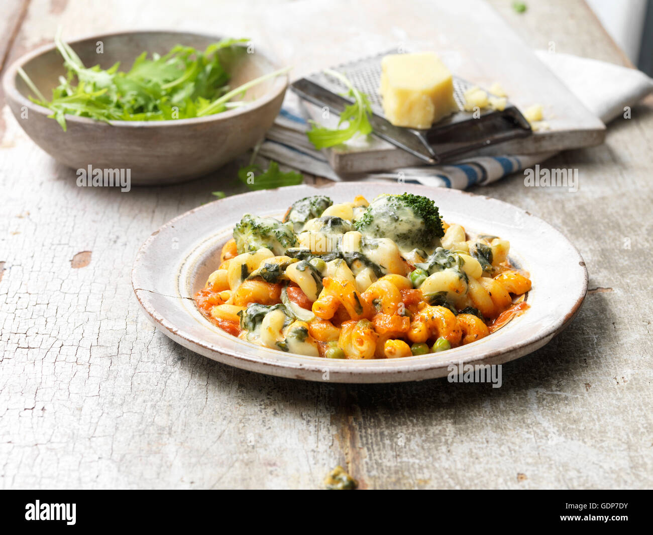 Food vegetarian meals vegetable pasta bake wooden table Stock Photo