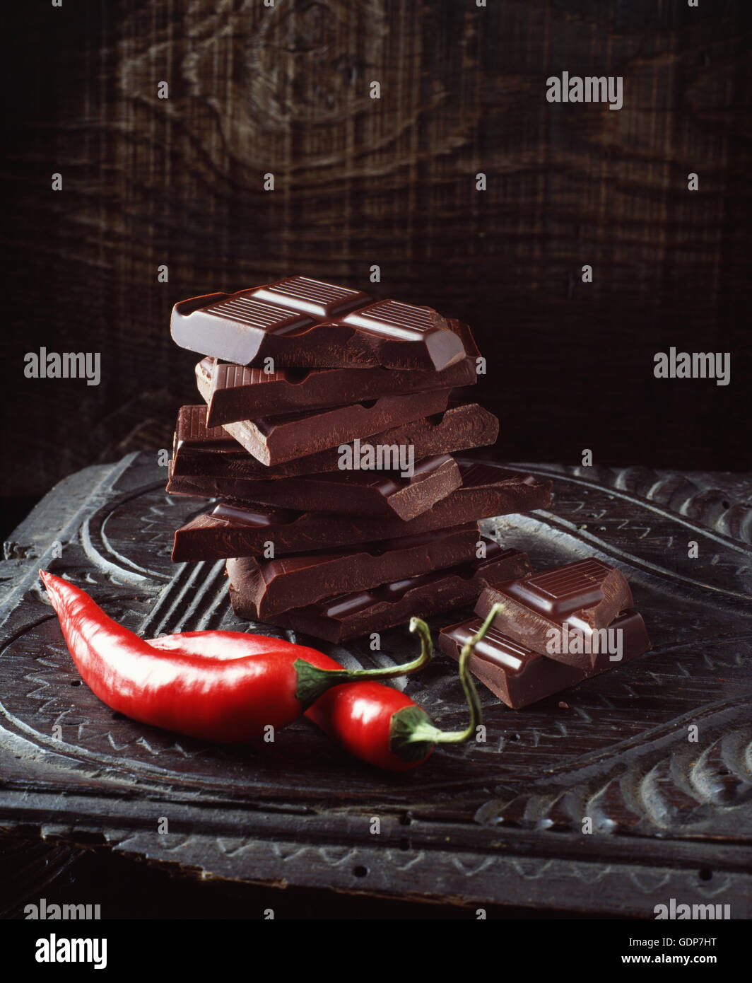 Food, chilli chocolate, raw red chilli peppers, vintage wooden surface Stock Photo