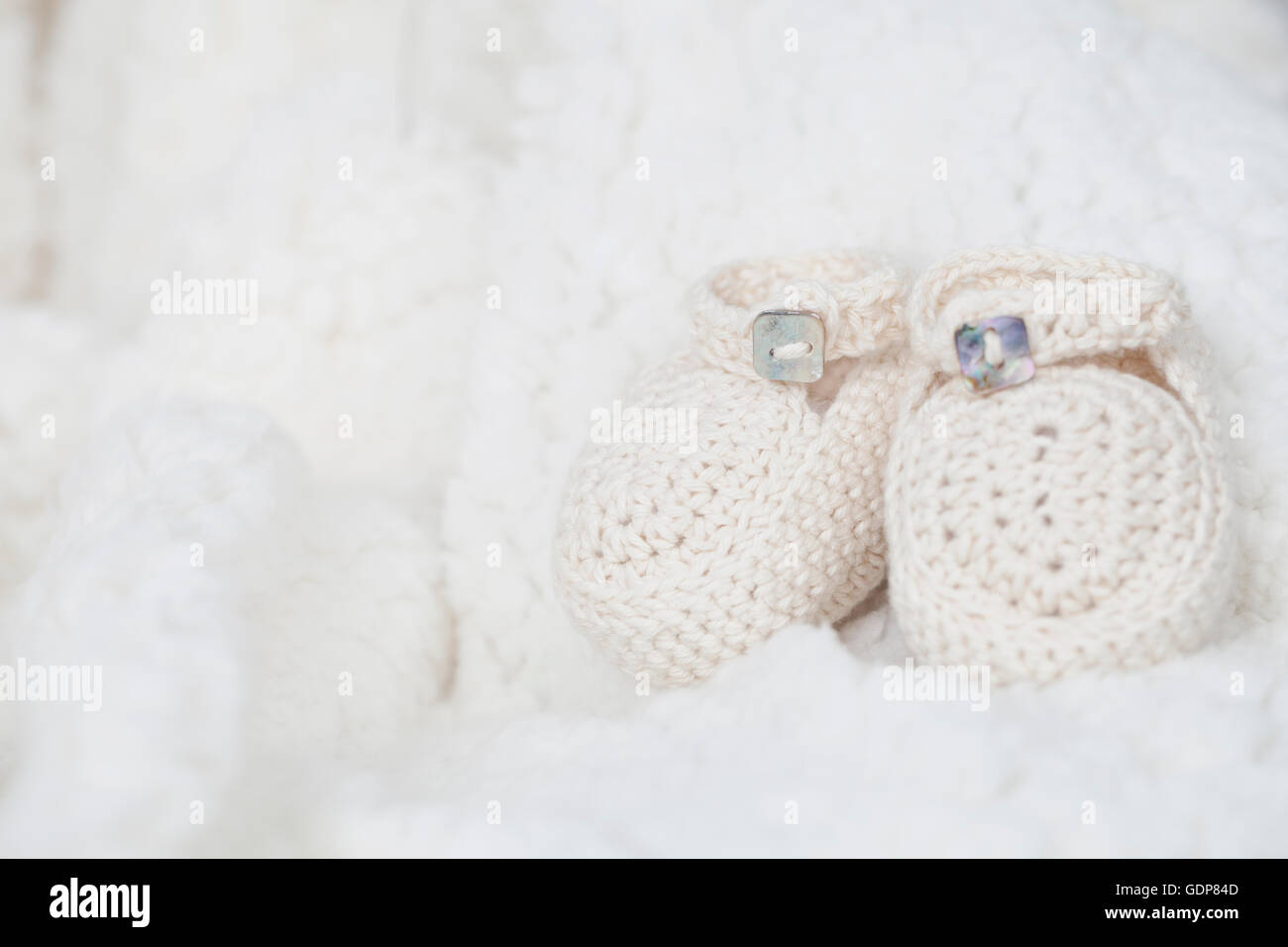 Knitted baby shoes, close-up Stock Photo