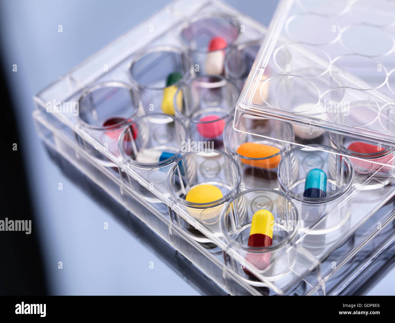 Pharmaceutical research, variety of medical drugs in a multi well tray