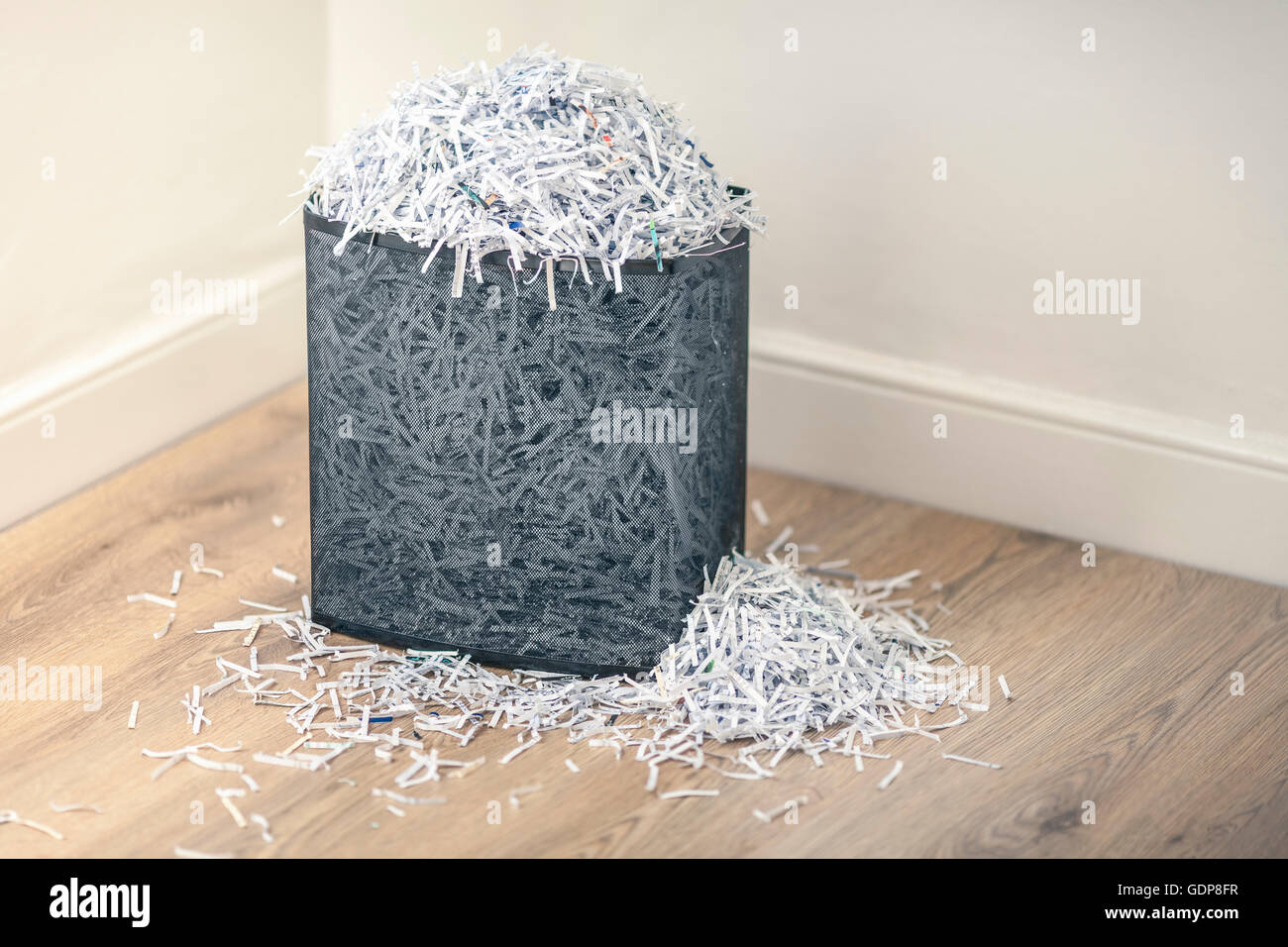 Overflowing shredded paper in paper shredder basket Stock Photo Alamy