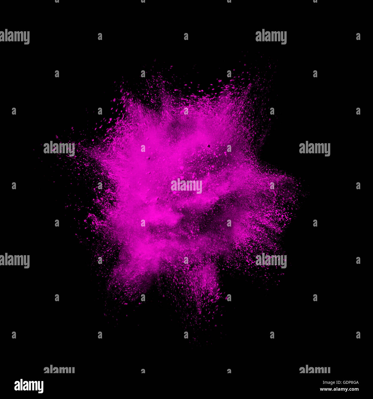 Pink dust exploding mid air against black background Stock Photo