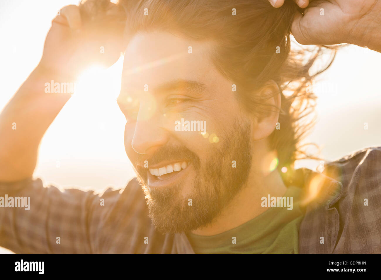Man against glaring sun Stock Photo