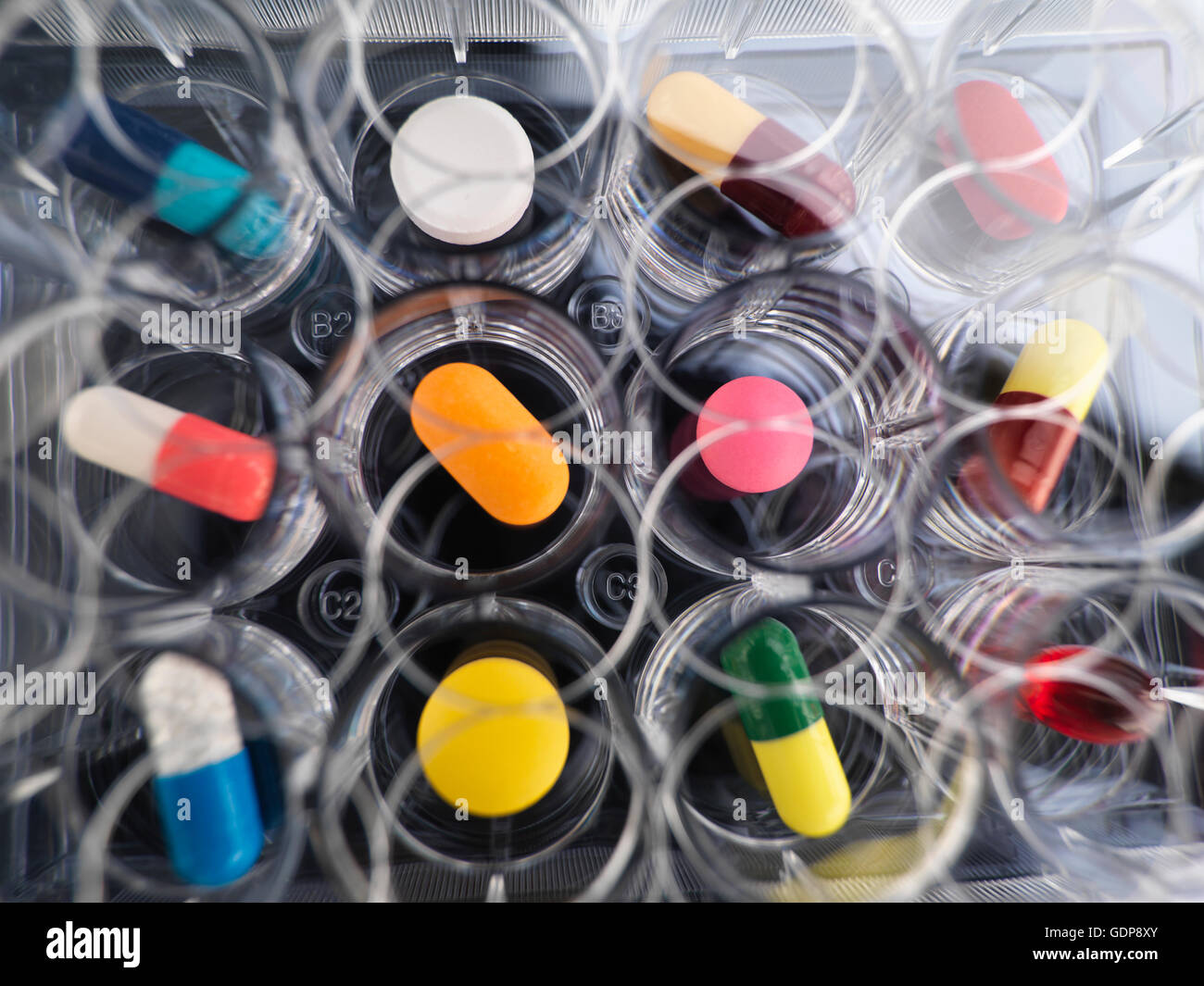 Pharmaceutical research, overhead view of  variety of medical drugs in a multi well tray for laboratory testing Stock Photo