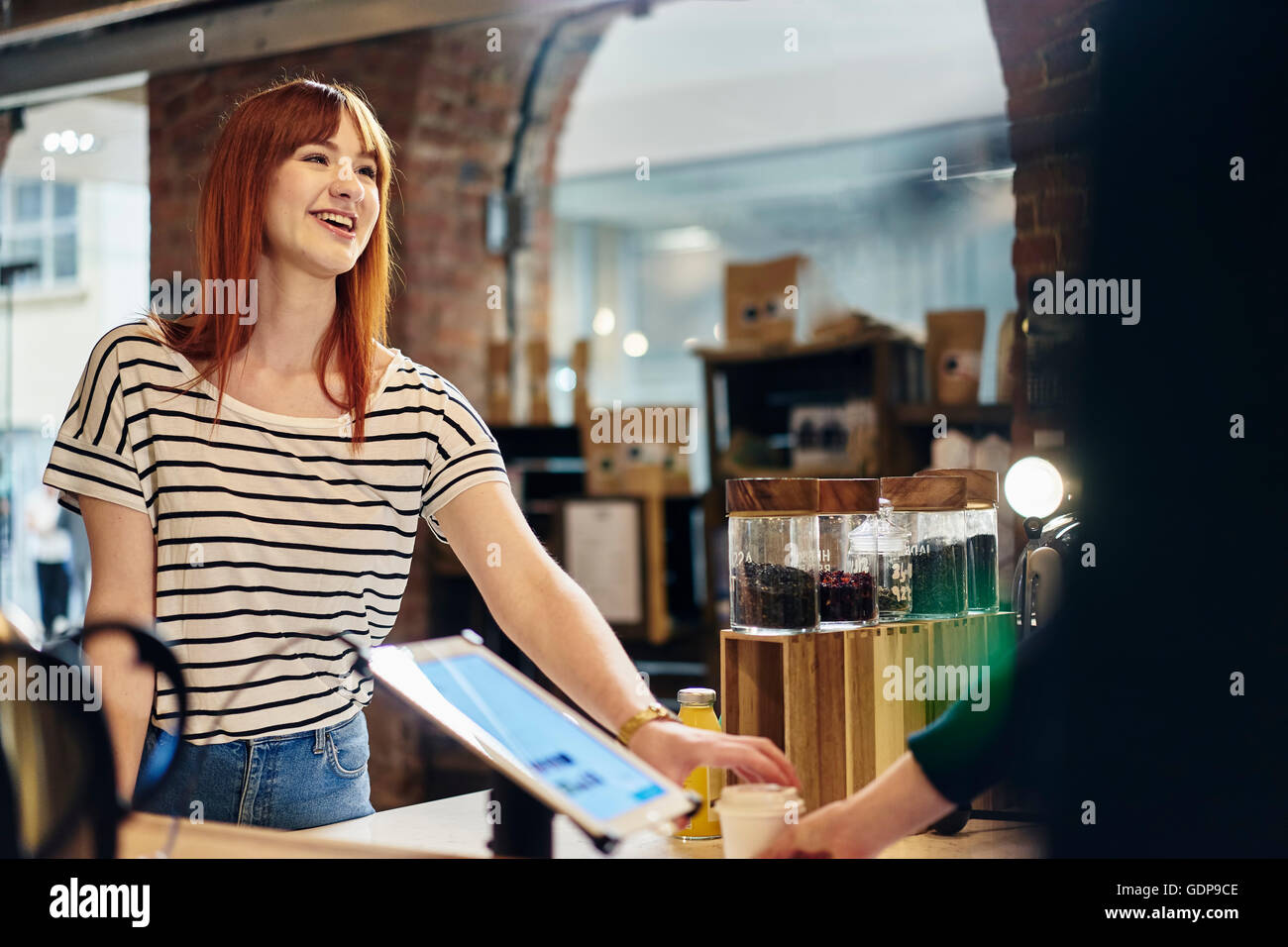 Female customer ordering from coffee shop counter Stock Photo Alamy