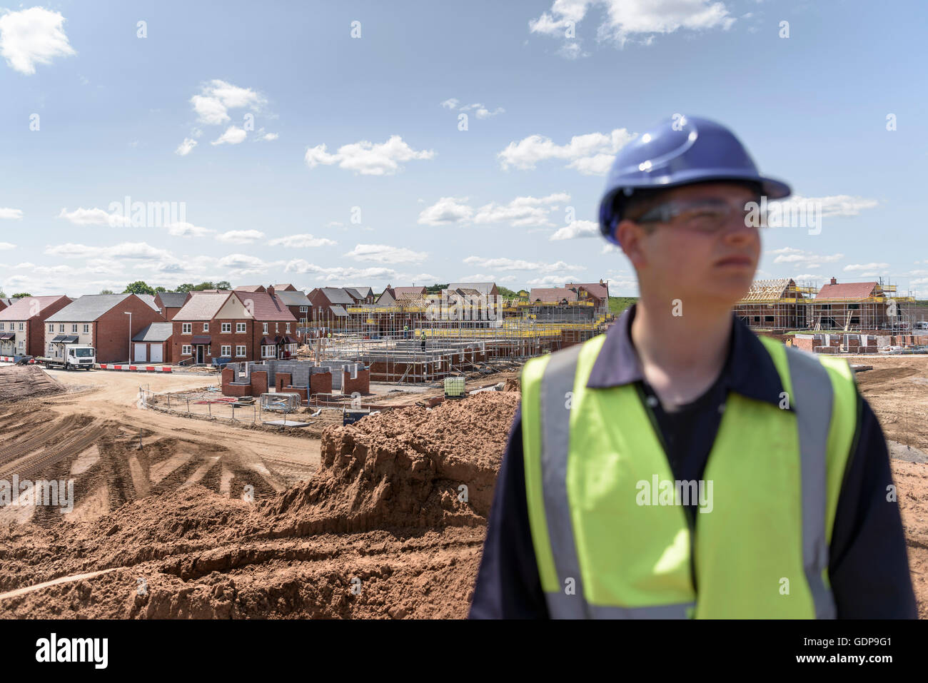 Builder on housing building site Stock Photo