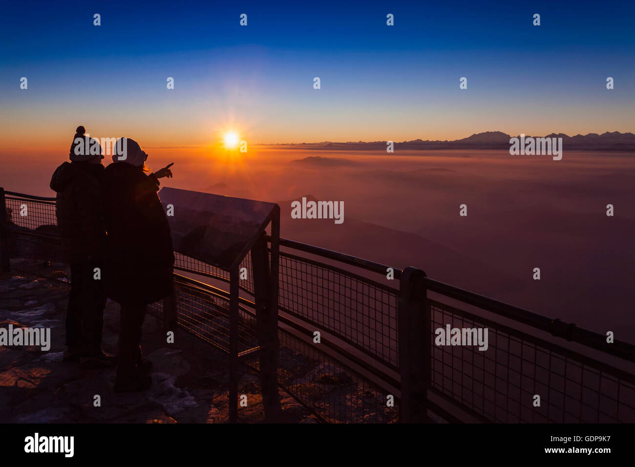 Hiking pointing sunset couple hi-res stock photography and images - Alamy