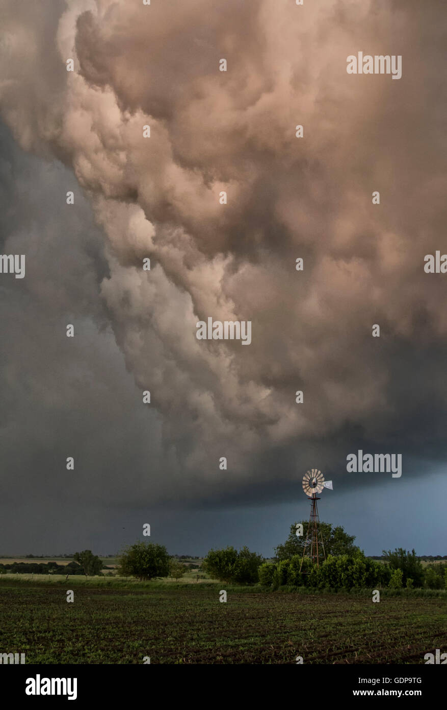 'Whales mouth' cloud structure above field Stock Photo