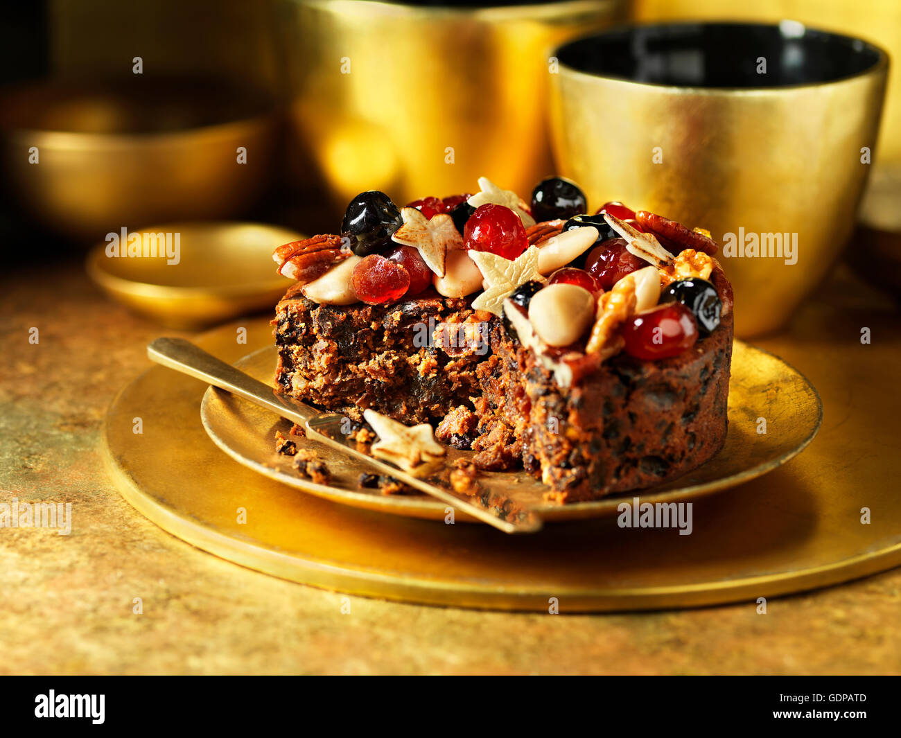 Fruit and nuts decorating traditional fruit christmas cake Stock Photo