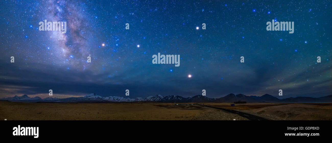 A starry sky over the Himalayas in Tibet, China. On the left (south) the bright central bulge of the Milky Way in the constellat Stock Photo