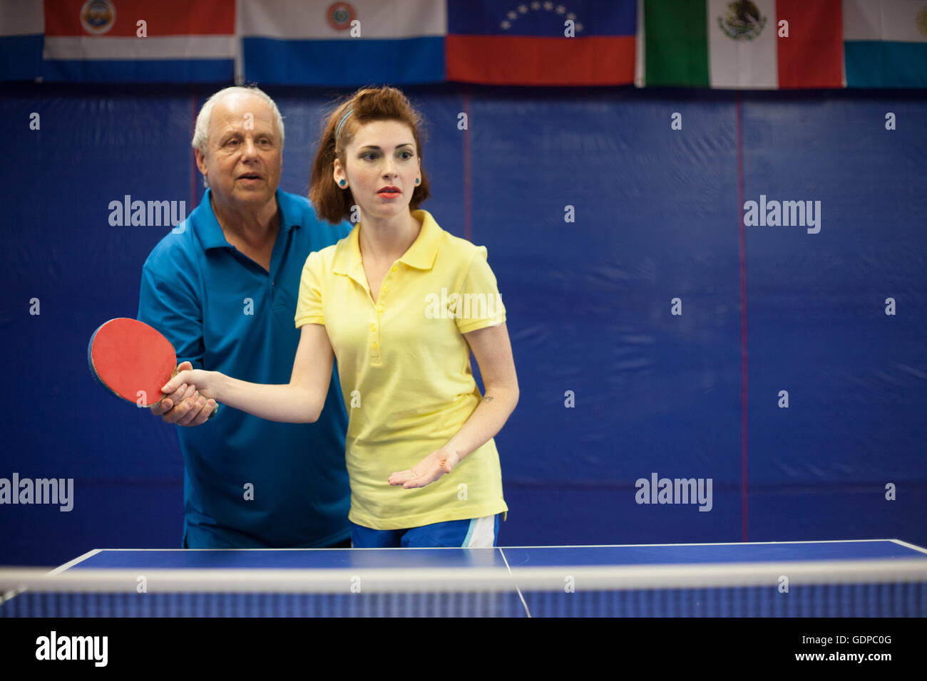 Table tennis coach teaching student to play Stock Photo Alamy