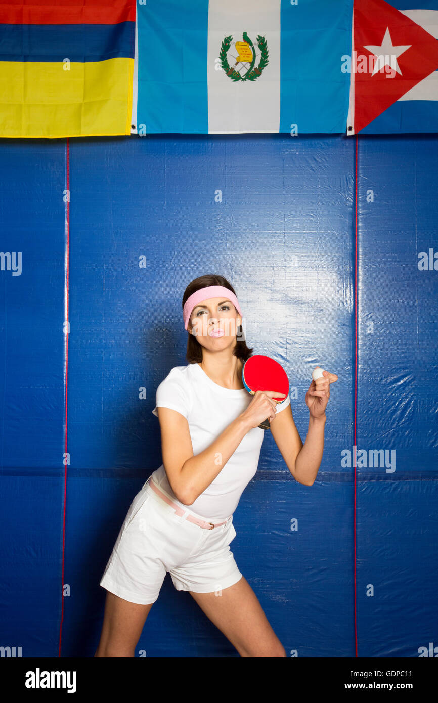 Table tennis player posing with bat and ball Stock Photo Alamy