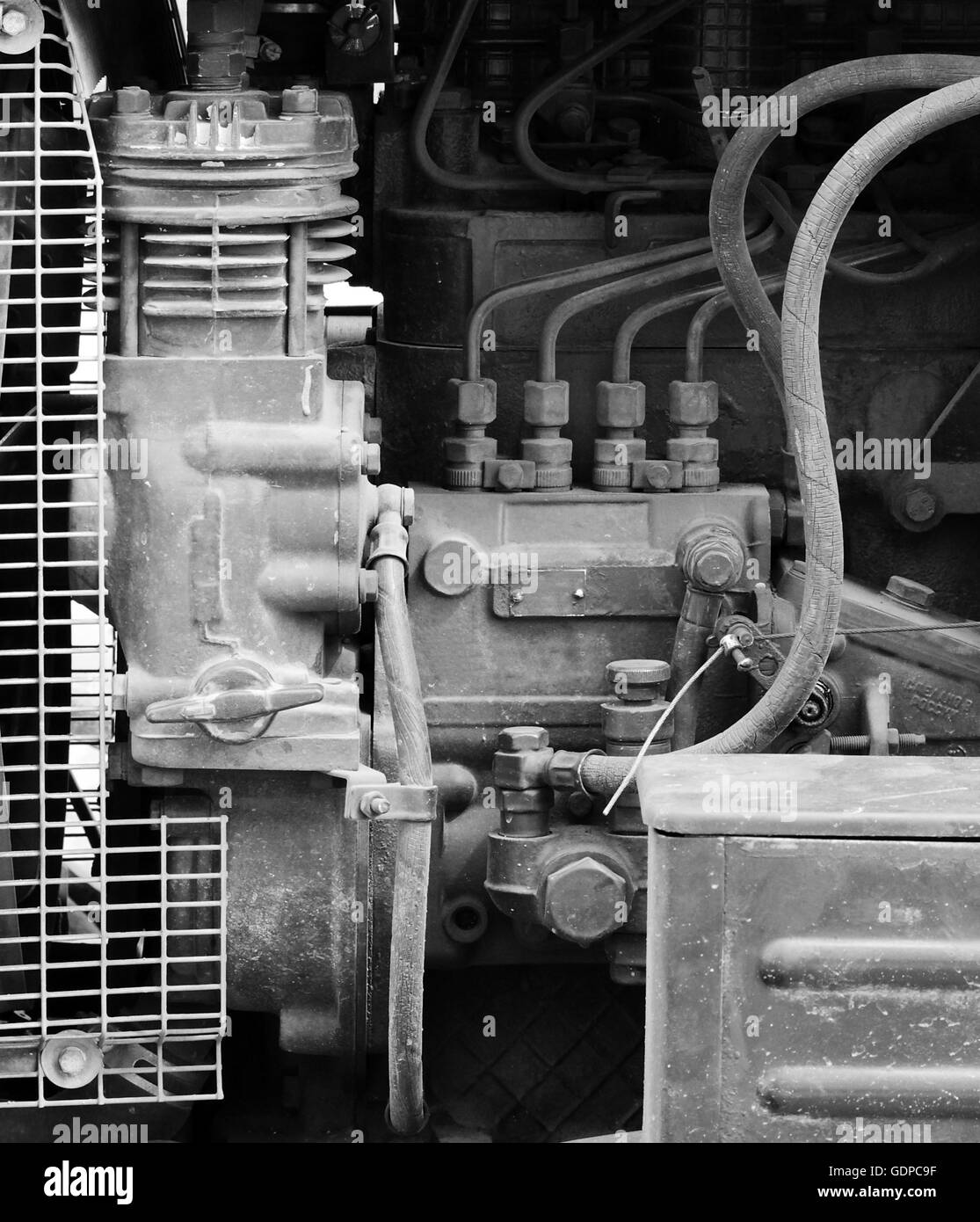 hoses, engine and spare parts inside the hood of the tractor Stock ...