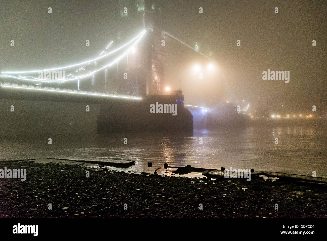 Foggy night and Tower Bridge London England UK Stock Photo