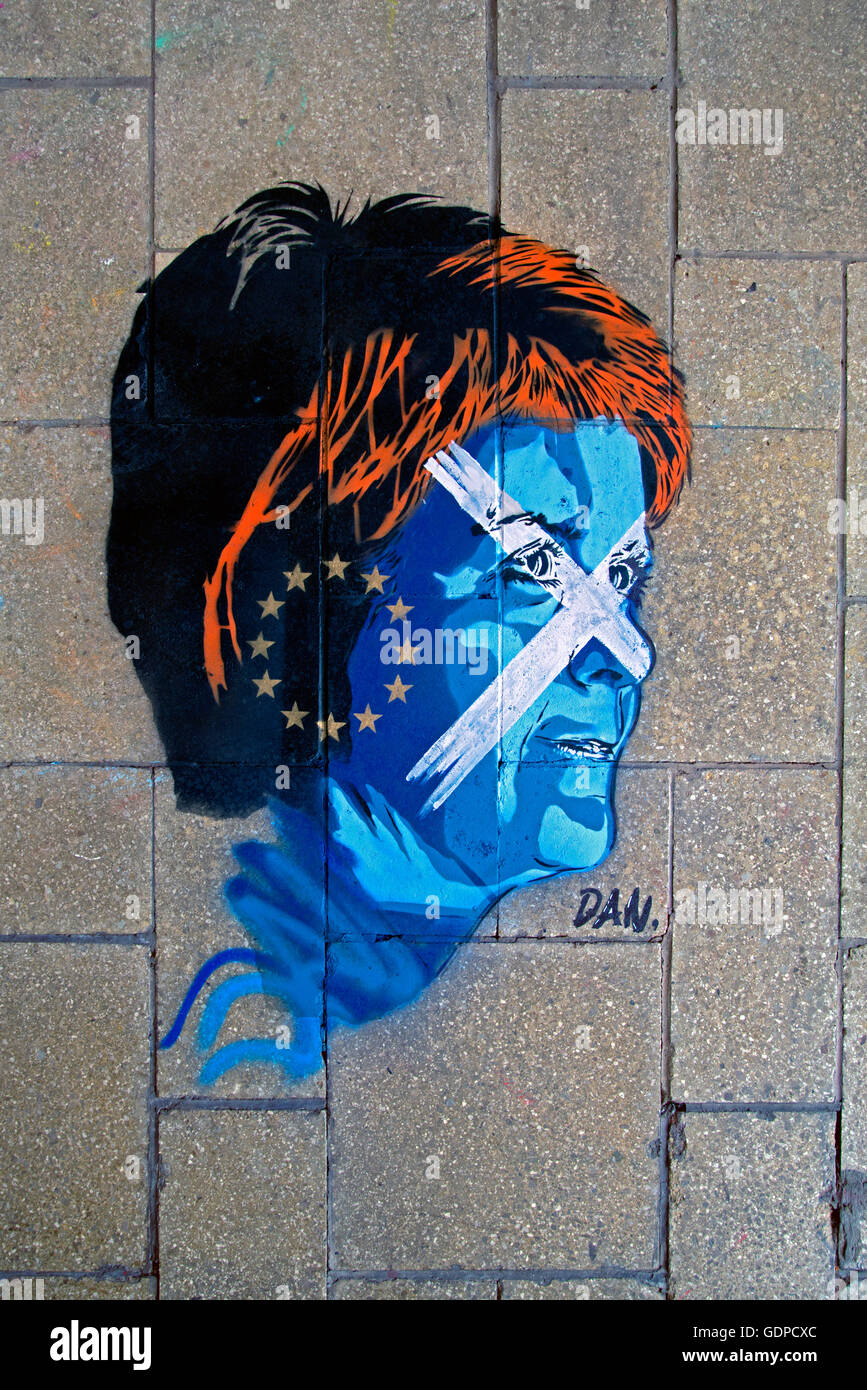 A not very flattering piece of graffiti depicting Scottish FM Nicola Sturgeon with a Saltire and EU flag painted on her face. Stock Photo