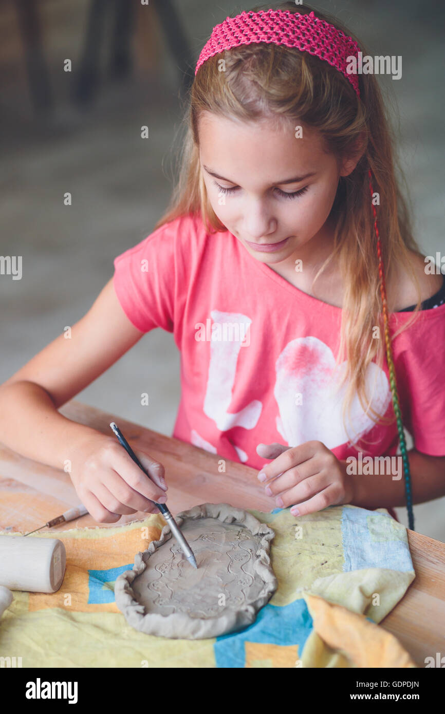 Girl making her first pottery in ceramic Stock Photo Alamy