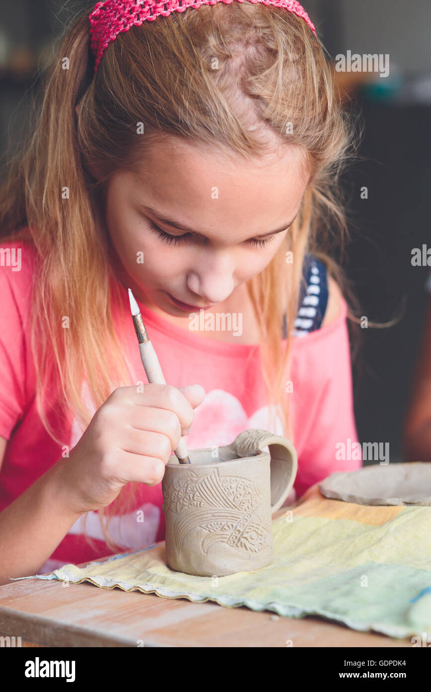 Girl making her first pottery in ceramic Stock Photo Alamy