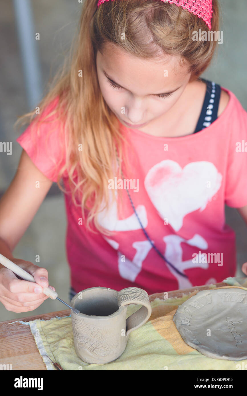 Girl making her first pottery in ceramic Stock Photo Alamy
