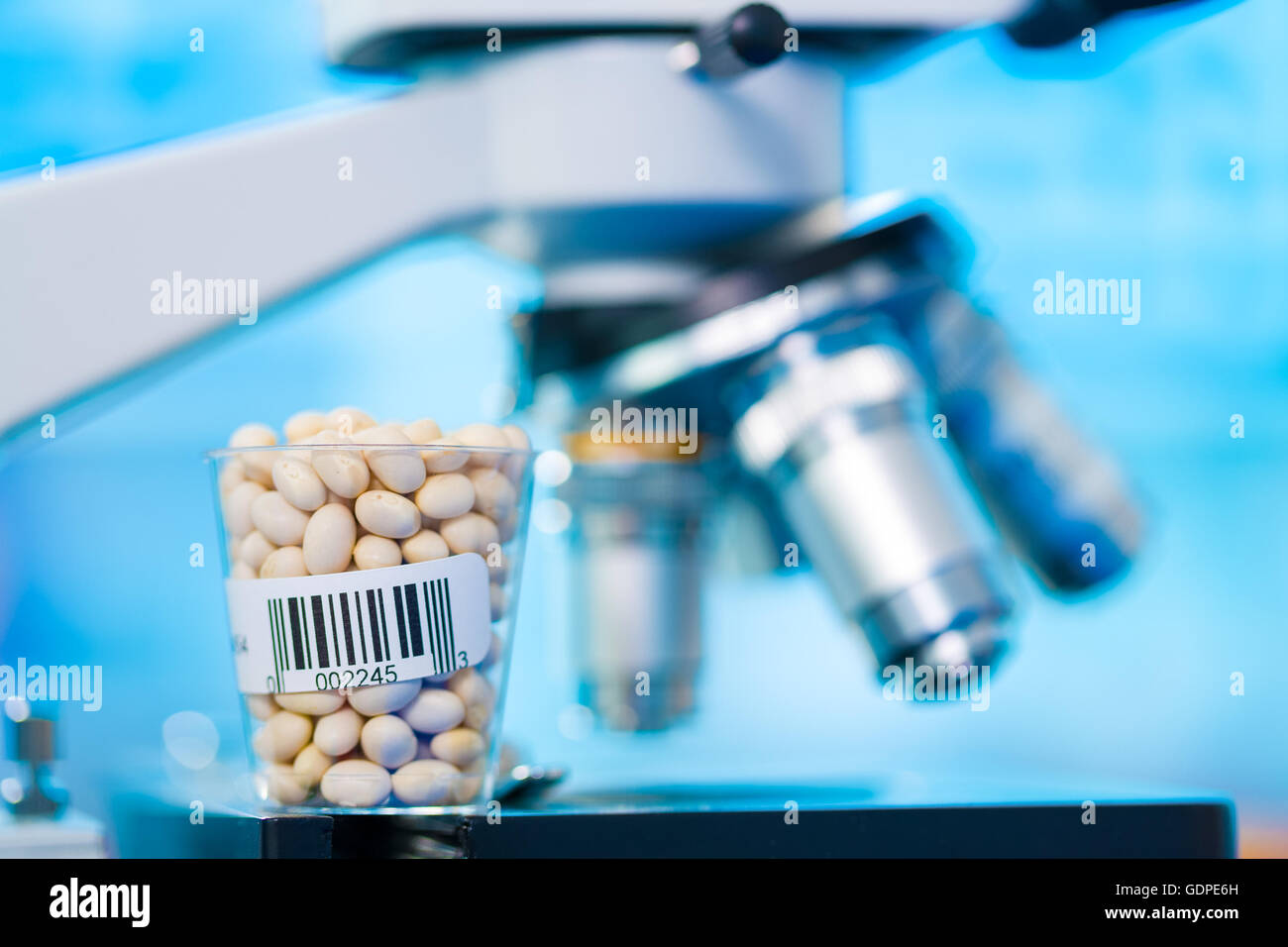 Beans in laboratory microscope background Stock Photo